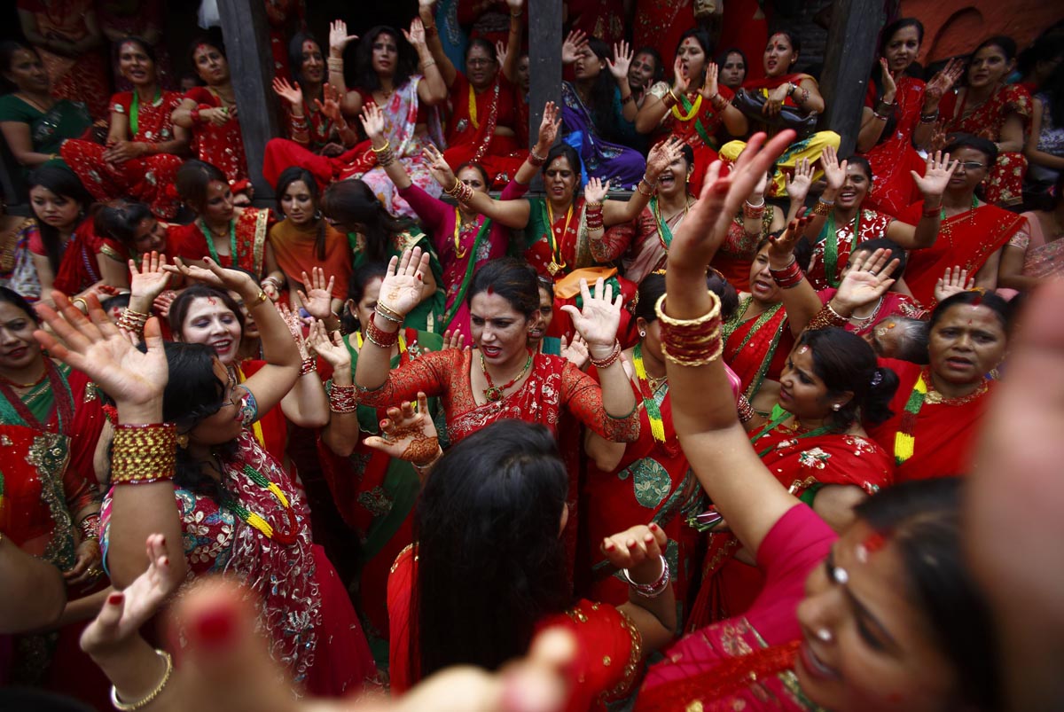 Women sing and dance at Pashupatinath Temple during the Teej festival in Kathmandu